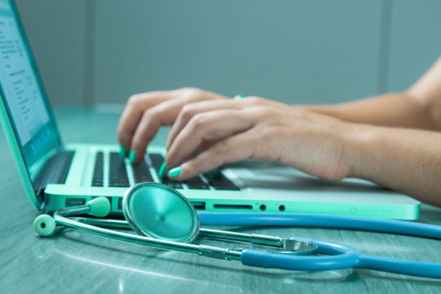 A clinician reviewing patient data on a tablet